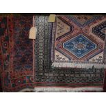 A selection of three eastern rugs, each with geometric detail, 80 x 95cm, 130 x 80cm and a further