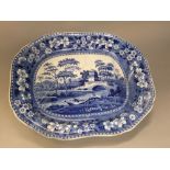 A large Spode blue and white printed meat dish in the Blue Tower pattern, together with gravy