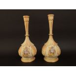 A pair of late 19th century Royal Worcester bottle neck vases with panels of wisteria, with