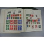 A Strand stamp album 17th Edition, together with a further album containing a worldwide selection of