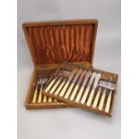 A Mappin & Webb silver plated bone handled, two tier fish cutlery canteen on an oak case