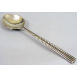 1920 Silver rat tail spoon by Omar Ramsden, with stylised hammered finish, London 1929, 18cms long