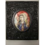 A 19th century Moghul portrait miniature - female in resplendent robes - in a solid carved