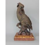 A cast bronze figure of a parrot upon a marble plinth with gadrooned and gilded details, 35cm high