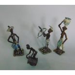 Four African bronze figures carrying water and shooting arrows, two musicians, all with partially