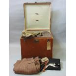 A travelling trunk filled with a collection of antique clothing including men's breeches dated 1915,