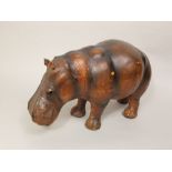 Interesting leather clad study of a hippopotamus in the manner of Liberty, with glass eyes, 49 cm