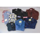 A collection of vintage Levi & Wrangler clothing to include three unused Levis shirts, three Levis