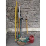 A collection of mainly contemporary long handled gardening tools