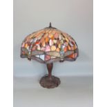 Tiffany style leaded glass lamp and stand, the shade decorated with geometric study of dragonflies