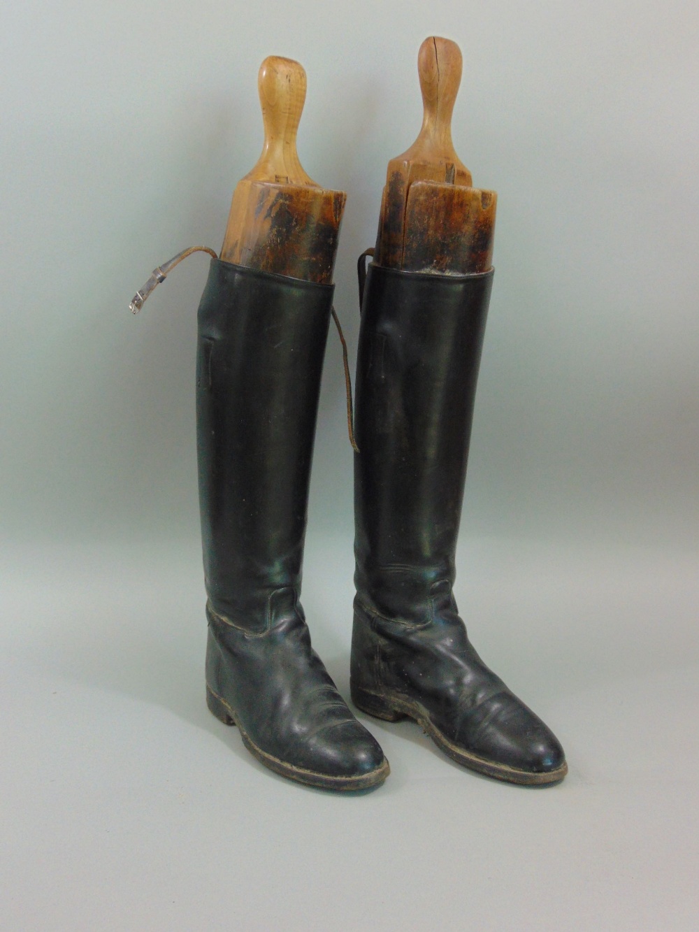 A pair of black leather early 20th century Regent hunting boots, size 6.5 with wooden trees