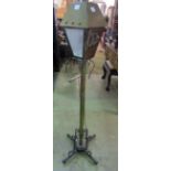 An Arts & Crafts style standard lamp in the form of a street lantern, the square tapered hood