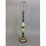 A table lamp with cast brass framework and onyx panels