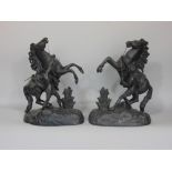 Pair of French spelter figures of a man walking a charging horse, 42 cm high (2)