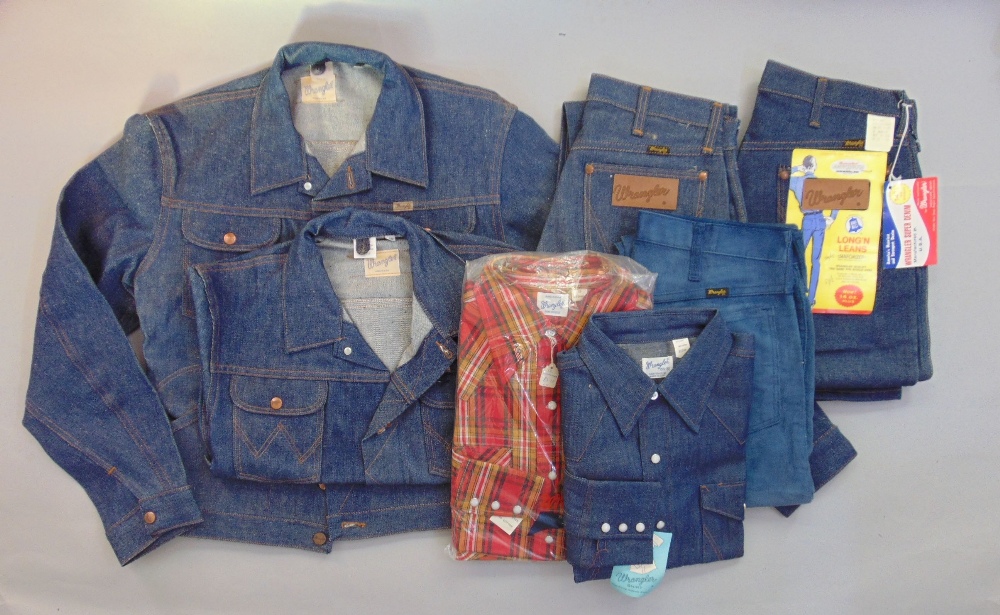 A collection of Vintage Wrangler clothing all in unused condition to include two denim jackets (