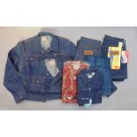 A collection of Vintage Wrangler clothing all in unused condition to include two denim jackets (