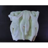 A plaster wall hanging of three nudes, 43 cm high