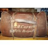 An ex-Rifle Brigade bedroll/kit bag with various compartments and leather belt straps, initialled BM