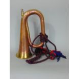A brass and copper military bugle by George Potter & Co of Aldershot