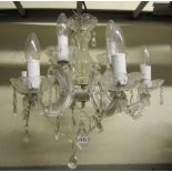 A small hanging six branch glass chandelier with prism swags and droplets together with a pair of