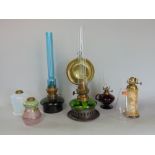 A collection of small lamps to include one painted glass font base, one opaline glass font base, one
