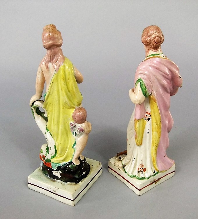 A pair of early 19th century Staffordshire classical allegorical female figures, both raised on - Image 2 of 2