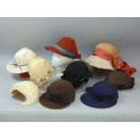 A large collection of vintage ladies hats including hats from Harrods and Lilly whites