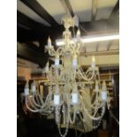 A pair of impressive moulded glass chandeliers (electrified) the faceted stems supporting eighteen