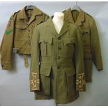 Three rifle brigade military jackets from World Wars I & II, a World War II navy uniform for a