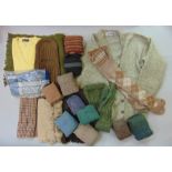 A collection of vintage men's woollen garments to include scarves, balaclavas, a quantity of full