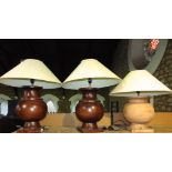 Three large turned wooden table lamps to include a pair of stained examples and a further soft