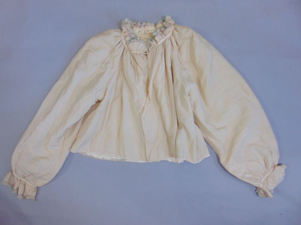 A pink silk bed jacket with hand stitching and applied flower decoration, a further bed jacket in - Image 4 of 4