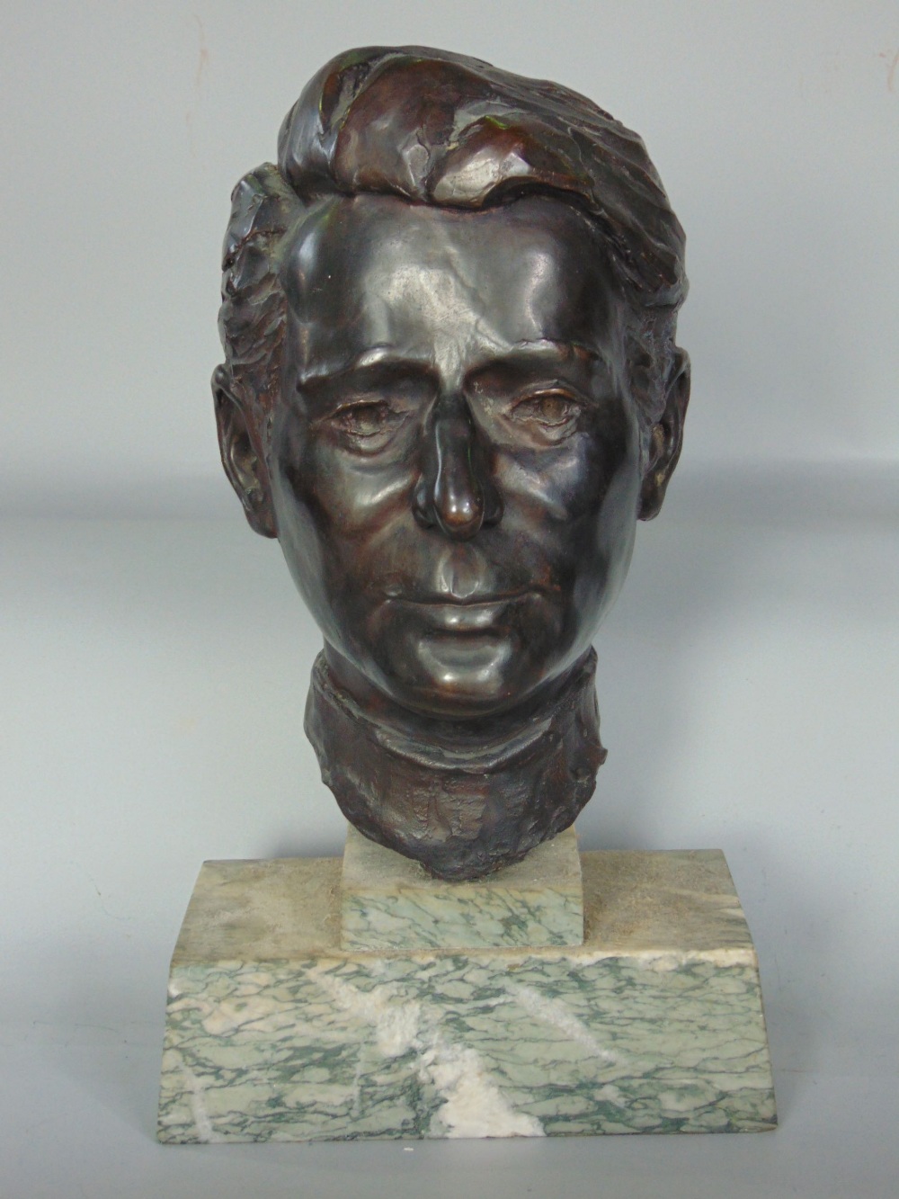 Mid 20th century bronze bust study of a gentlemen's head, upon a stepped square marble plinth