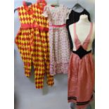 A collection of vintage fancy dress costumes to include jester and bo-peep, together with a black