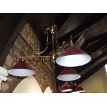 A pair of Edwardian style three branch overhead light fittings with conical shaped ruby glass