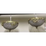 A pair of empire style hanging basket lights with cast gilt metal mounts and prism drops