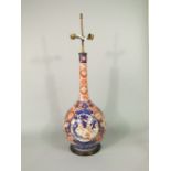 A 19th century imari bottle shaped vase with drawn neck (presented as a lamp with double fitting