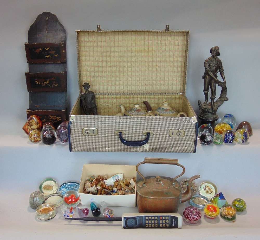 A collection of miscellaneous items to include a spelter figure of a fisherman, a vintage cellular