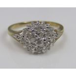 A 9ct diamond cluster ring, size N, 2.7g