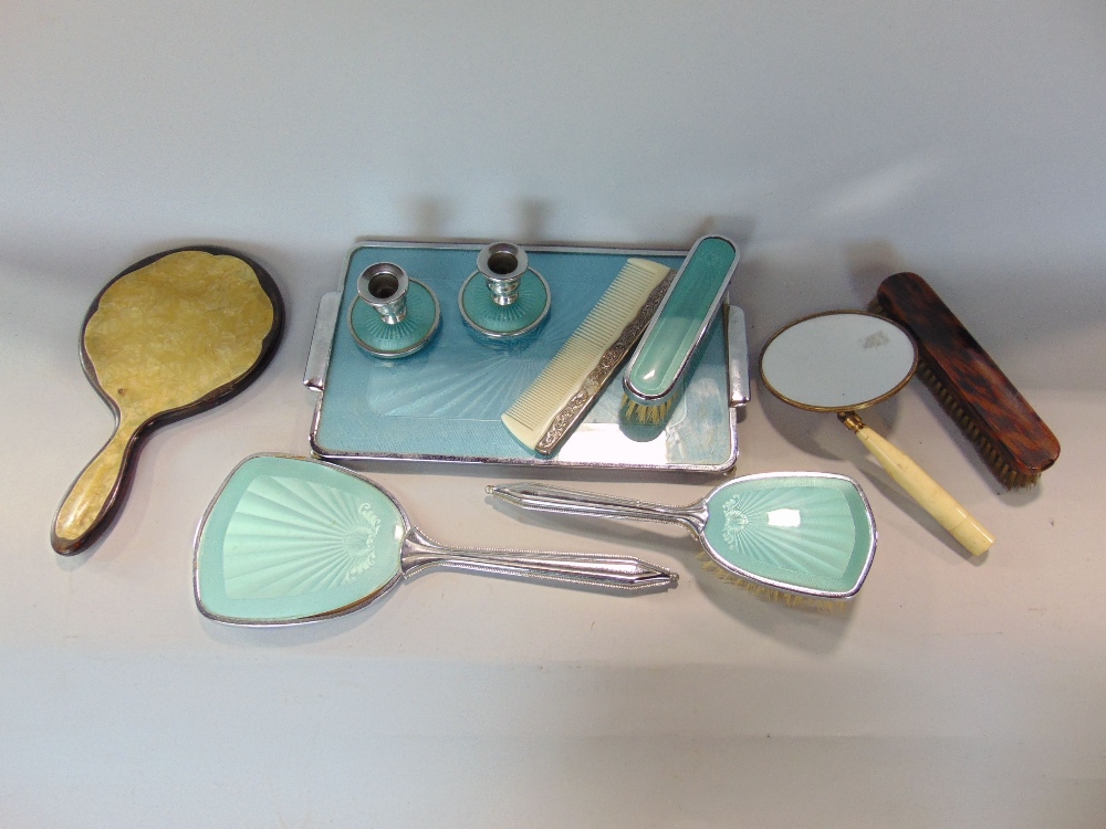 A collection of various dressing set items to include silver and tortoiseshell examples