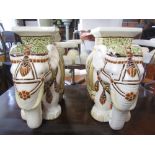 A pair of contemporary glazed ceramic garden seats in the form of elephants with decorative and