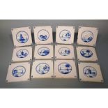 A set of twelve blue and white painted Delft tiles with coastal landscape and windmill decoration,