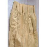 Six heavy weight curtains in a light gold silk like fabric, each with triple pleat heading, black