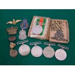 Three 1939 - 45 war medals, defence medal, military badges, etc