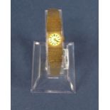 Vintage ladies 9ct Accurist 17 jewel cocktail watch, the champagne dial with baton markers upon a