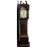 A Regency mahogany longcase clock, the case with trailing inlaid brass bands, the hood with column