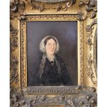 19th century British school - Half length portrait of a lady in black with lace bonnet, oil on