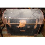 A Victorian fibre stitched leather reinforced basket lined domed top travelling trunk together