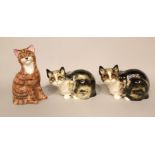 Two Winstanley models of crouching tabby and white cats, both with painted marks to base and numbers