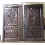 A pair of 19th century carved oak twin panelled cupboard doors with flowering urns and repeating